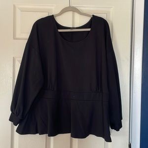 Peplum top with cuffed sleeves